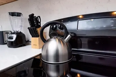 a tea kettle sitting on top of a stove at Bayshore Breeze Free Parking 5 in Fort Lauderdale