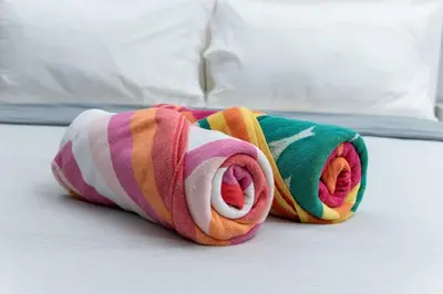 a colorful towel is laying on a bed at Bayshore Breeze Free Parking 7 in Fort Lauderdale