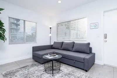 a living room with a couch and a table at Bayshore Breeze Free Parking 9 in Fort Lauderdale