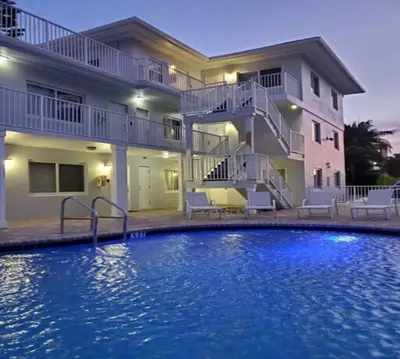a large swimming pool in front of a house at Bayshore Breeze 10 in Fort Lauderdale
