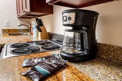 a coffee maker sitting on top of a kitchen counter at Ocean Breeze Free Parking Apt 1 in Fort Lauderdale