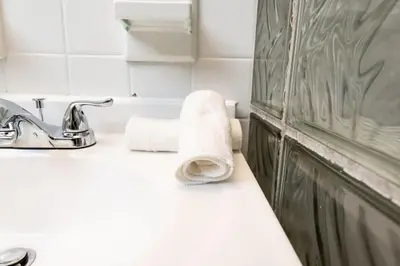 a bathroom with a sink and a towel at Ocean Breeze Free Parking Apt 1 in Fort Lauderdale