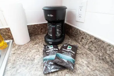 a coffee maker sitting on a counter next to a sink at Ocean Breeze Free Parking Apt 5 in Fort Lauderdale