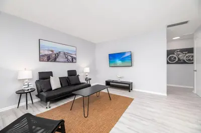 a living room with a couch and a table at Short Walk to Wilton Drive Apt2 in Fort Lauderdale
