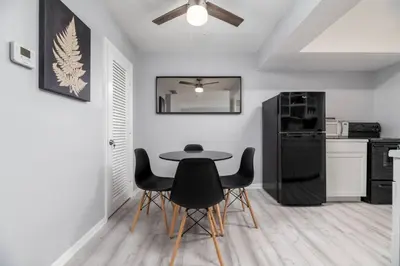 a dining room with a table and chairs in a kitchen at Short Walk to Wilton Drive Apt2 in Fort Lauderdale