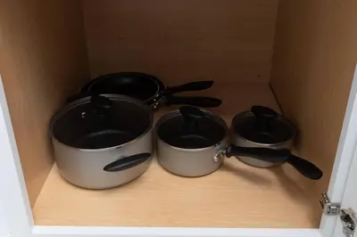 three pots and pans sitting inside of a box at Short Walk to Wilton Drive Apt2 in Fort Lauderdale