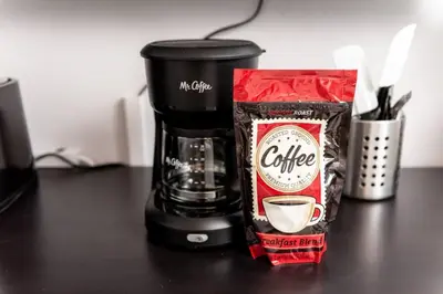 a bag of coffee sitting next to a coffee maker at Short Walk to Wilton Drive Apt5 in Fort Lauderdale