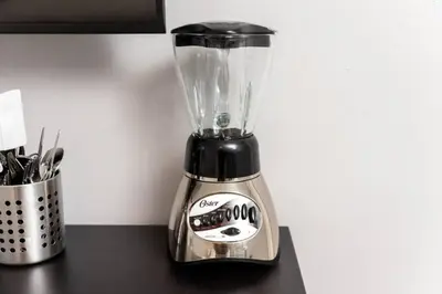 a black and silver blender sitting on top of a counter at Short Walk to Wilton Drive Apt5 in Fort Lauderdale