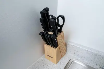 a knife block with knives in it on a counter at Short Walk to Wilton Drive Apt6 in Fort Lauderdale