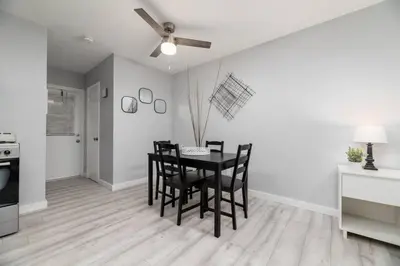 a kitchen and dining room with a table and chairs at Just Off Wilton Drive Apt 3 in Fort Lauderdale