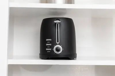 a black appliance is sitting on a shelf at Just Off Wilton Drive Apt 3 in Fort Lauderdale
