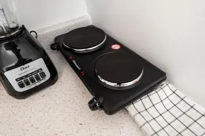 a black blender sitting on top of a counter at Just Off Wilton Drive Apt 4 in Fort Lauderdale