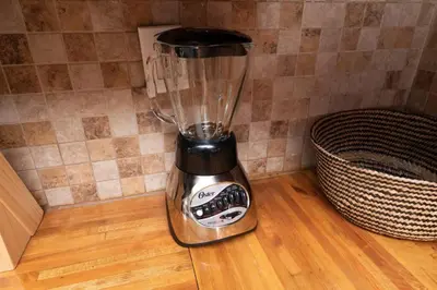 a blender sitting on top of a wooden floor at Just Off Wilton Drive Apt 6 in Fort Lauderdale