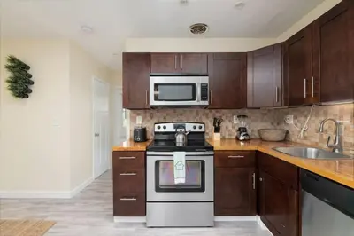 a kitchen with a stove and a microwave at Just Off Wilton Drive Apt 6 in Fort Lauderdale