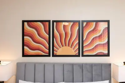 four pieces of art on a wall above a couch at Just Off Wilton Drive Apt 7 in Fort Lauderdale