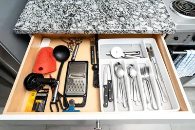 a drawer filled with kitchen utensils on a counter at Comfy Condos at Middle River Apt 2 in Fort Lauderdale