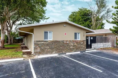 a house with a parking lot in front of it at Comfy Condos at Middle River Apt 3 in Fort Lauderdale