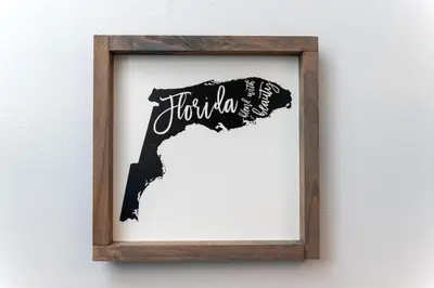 a framed picture of a dog with the word thailand at The Dolphin Studio at Lake Ridge in Fort Lauderdale