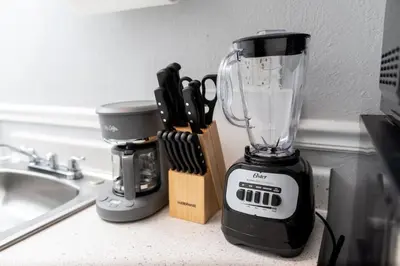 a blender sitting on a counter next to a sink at The Dolphin Studio at Lake Ridge in Fort Lauderdale