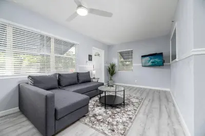 a living room with a couch and a table at The Residences at Lake Ridge Apt 3 in Fort Lauderdale