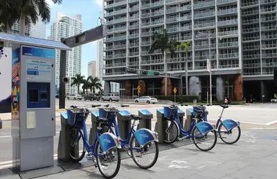 a row of bikes parked at a gas station at Lux 2BR - Water View - Pool - Spa - FREE Parking in Miami