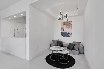 a living room with a couch and a table at Luxe Brickell Gem with Huge Balcony n Ocean Views in Miami