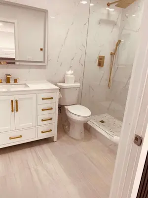 a white bathroom with a toilet and a shower at Cascada-Luxe Resort Heated Pool HotTub Wlk 2 Beach in Fort Lauderdale