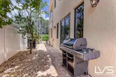 a barbecue grill sitting outside of a building at LVS Villa Alba- Walk2LasOlas, HeatedPool, RoofTopTerrace in Fort Lauderdale