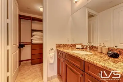 a bathroom with a sink and a large mirror at LVS Villa Alba- Walk2LasOlas, HeatedPool, RoofTopTerrace in Fort Lauderdale