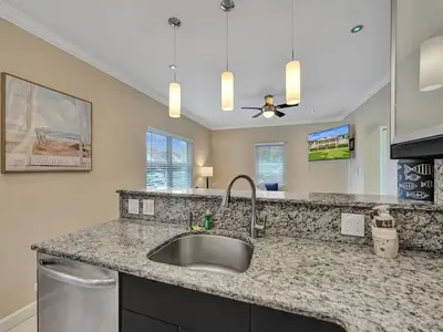 a kitchen with a sink and a counter top at Beach Isles Modern 1BR in Fort Lauderdale with Patio in Fort Lauderdale