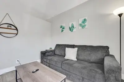 a living room with a couch and a coffee table at Rustic Retreats Cozy 1BR For 4 Guests Minutes From Las Olas in Fort Lauderdale