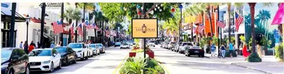 a street with cars parked on the side of the road at Rustic Retreats Cozy 1BR for 2 guests minutes from Las Olas in Fort Lauderdale
