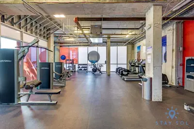 a gym with several treadmills and cardio machines at Costa Hollywood Beach in Hollywood