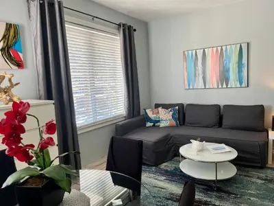 a living room with a couch and a table at Ocean Dream by the Beach in Miami Beach
