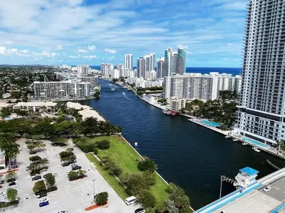 a view of a river in a city with tall buildings at Modern Apt by the Beach with Full Kitchen -A in Hallandale Beach