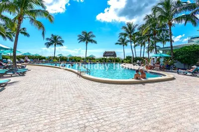 a swimming pool at a resort with palm trees at Apartment on the beach Tides Hollywood Beach 5th floor U in Hollywood