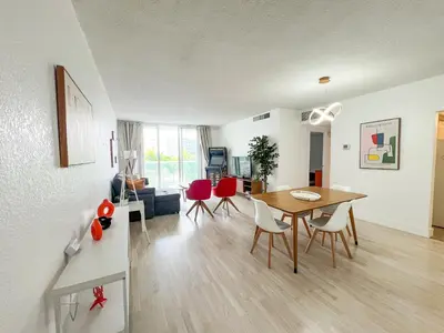 a living room with a dining room table and chairs at Apartment on the beach Tides Hollywood Beach 5th floor U in Hollywood