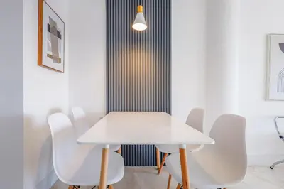 a white table and chairs in a room at La Marinita - Marina Views Pool Parking Location in Miami Beach