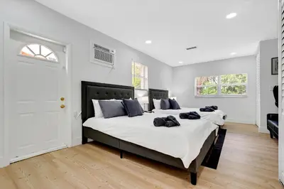 a bedroom with two large beds with white sheets at Casa Azul 4Bed 2Bath Home with Heated Pool & Spa 1304 in Hollywood