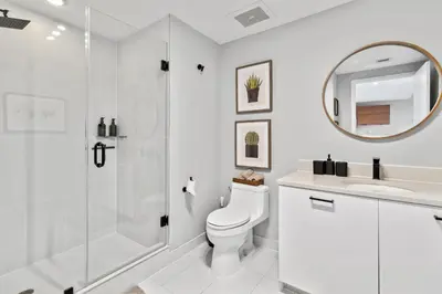 a bathroom with a shower and a toilet and a sink at Quiet & central Apt in Midtown Miami in Miami