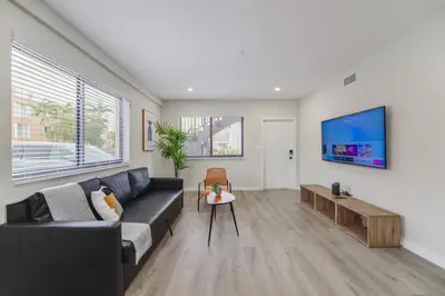 a living room with a couch and a tv at Heart of Little Havana Awaits in Miami