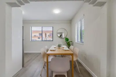 a dining room with a table and chairs at Heart of Little Havana Awaits in Miami