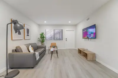 a living room with a couch and a table at Amazing Experience in Calle Ocho in Miami