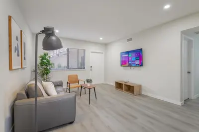 a living room with a couch and a table at Amazing Experience in Calle Ocho in Miami