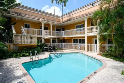 a large swimming pool in front of a building at Charming Apartment near Las Olas Blvd in Fort Lauderdale