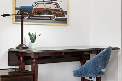 a desk with a chair and a car on the wall at Spacious Beach Apt in Las Olas Blvd in Fort Lauderdale