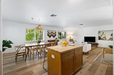 a living room with a table and a dining room at Spacious Beach Apt in Las Olas Blvd in Fort Lauderdale