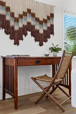 a wooden desk with a chair next to a window at Spacious Beach Apt in Las Olas Blvd in Fort Lauderdale