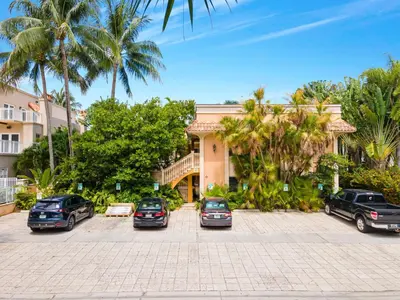a group of cars parked in front of a building at Relaxing Beach Apt in las Olas Blvd in Fort Lauderdale