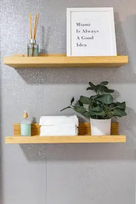 a wooden shelf with a potted plant and a picture at Coco Loco - Wynwood in Miami